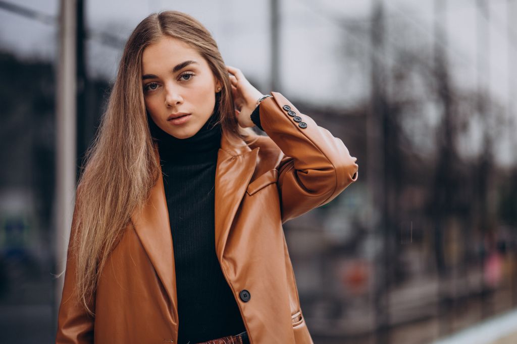 young-woman-in-jacket-walking-out-in-the-city.jpg