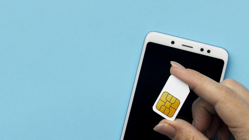 top-view-of-hand-holding-sim-card-with-smartphone-and-copy-space.jpg top-view-of-hand-holding-sim-card-with-smartphone-and-copy-space.jpg